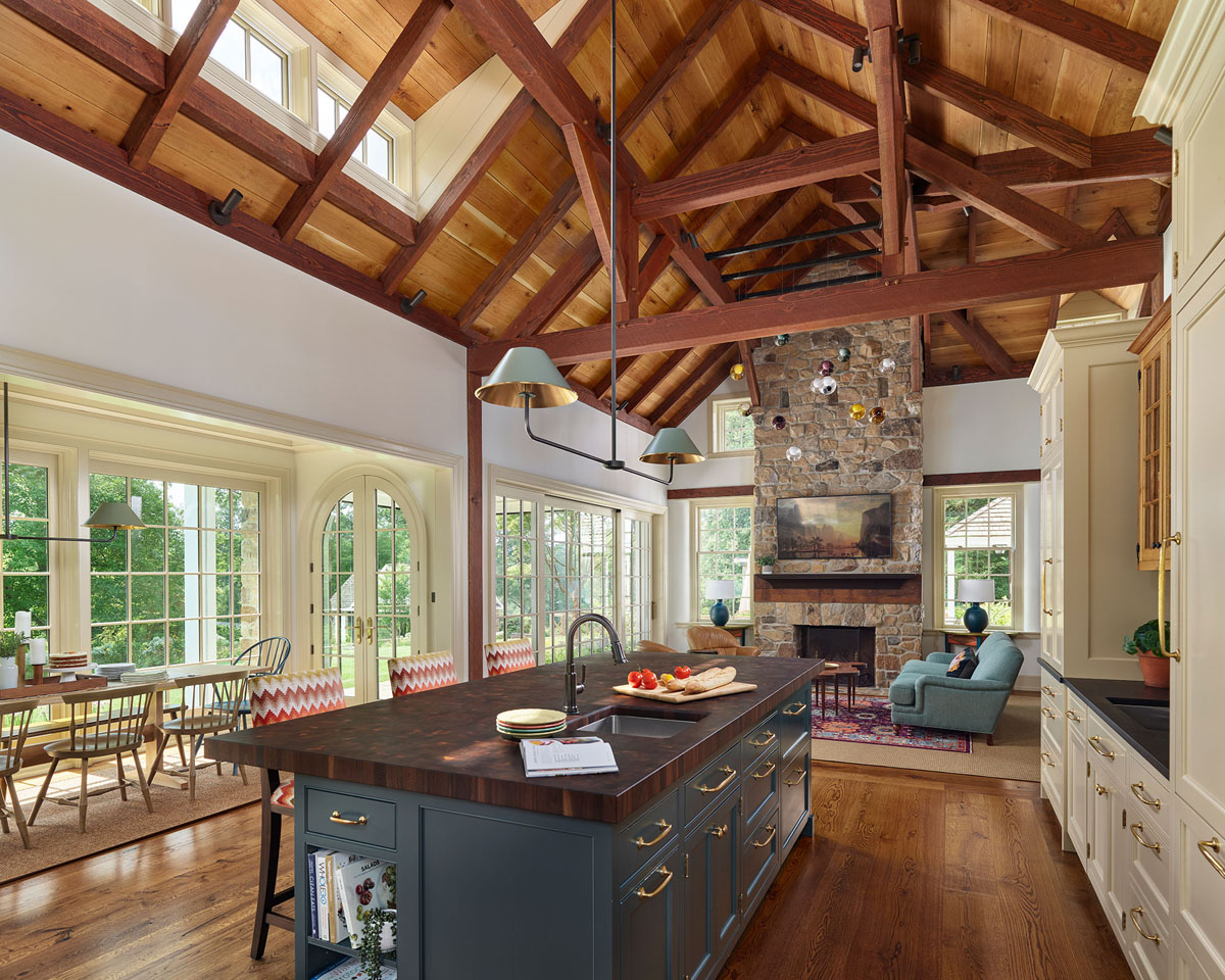 Country Home Family Room with Stone Fireplace and Vaulted Timber Frame Ceiling