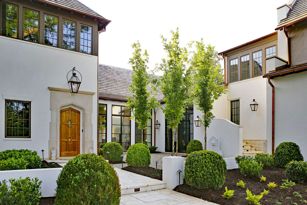 Modern Manor with Tudor-Influenced Front Door