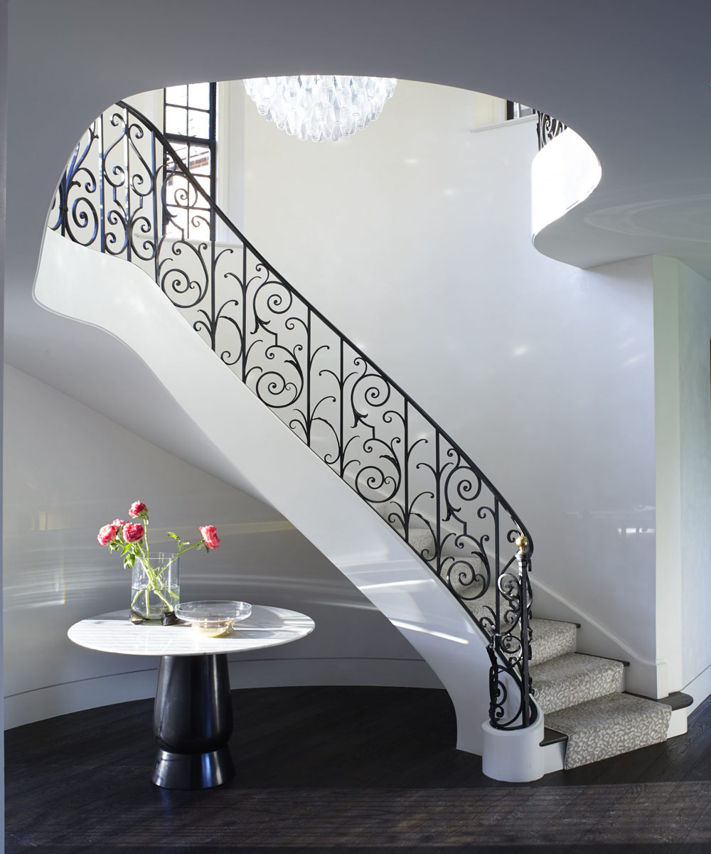 Elegant Curved Staircase with Metal Railing