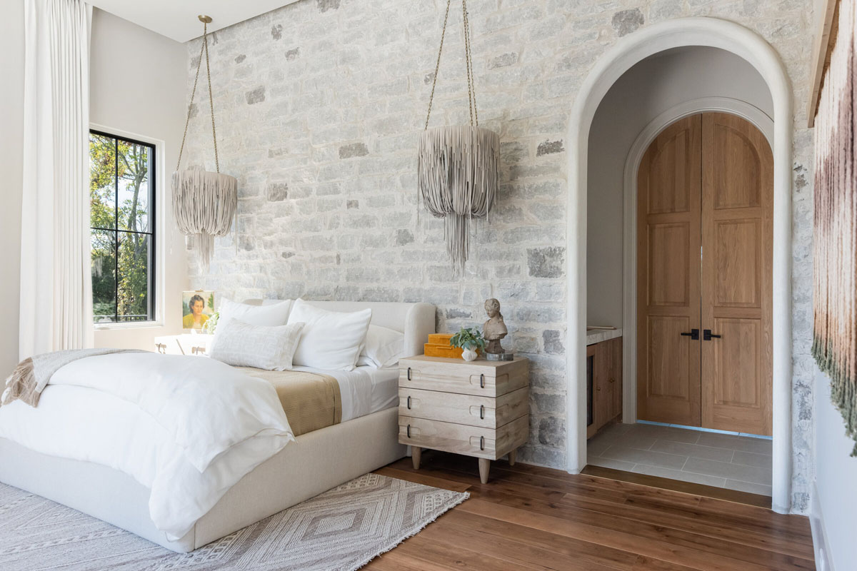 Bedroom with Stone Wall and Arched Doorway