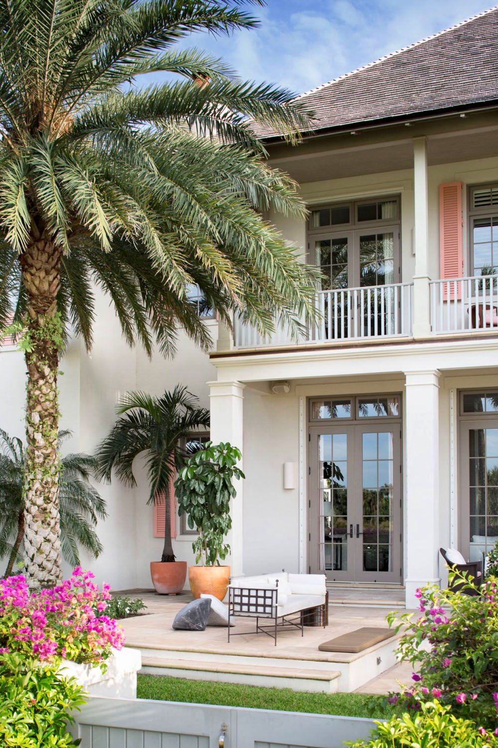 Anglo-Caribbean Architectural Style Exterior with Pink Shutters