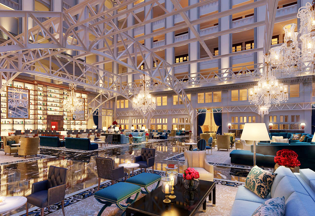 Grand Lobby elegantly finished with hand-woven area rugs, soaring brass fixtures and crystal chandeliers