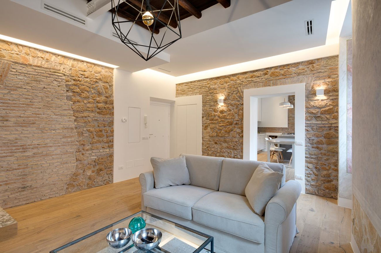 Modern Rome Apartment Living Room with Stone Walls