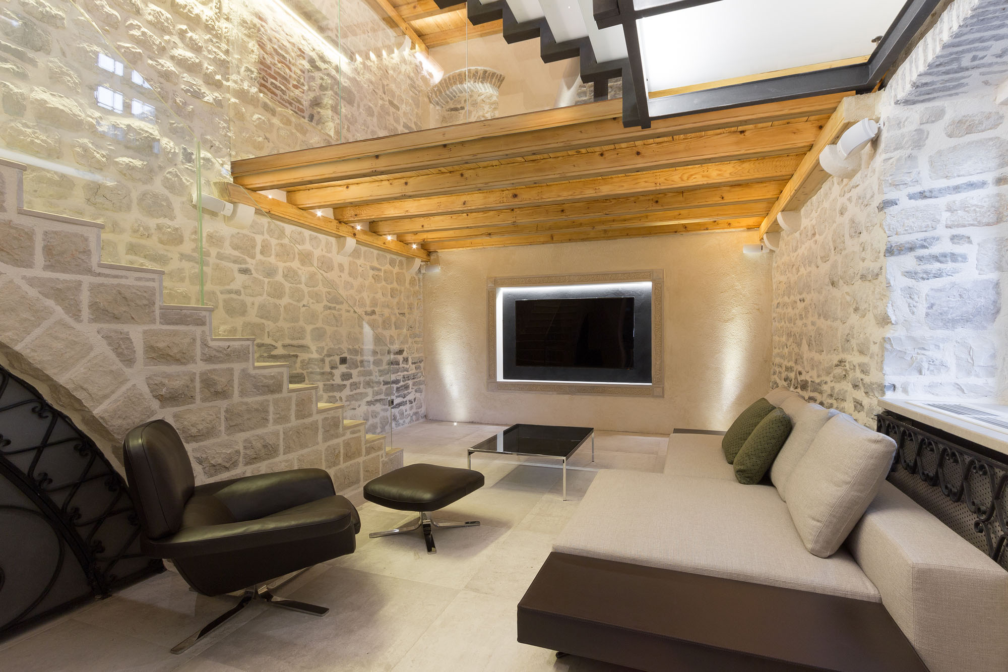 Entertainment Room with Stone Walls and Wood Beams
