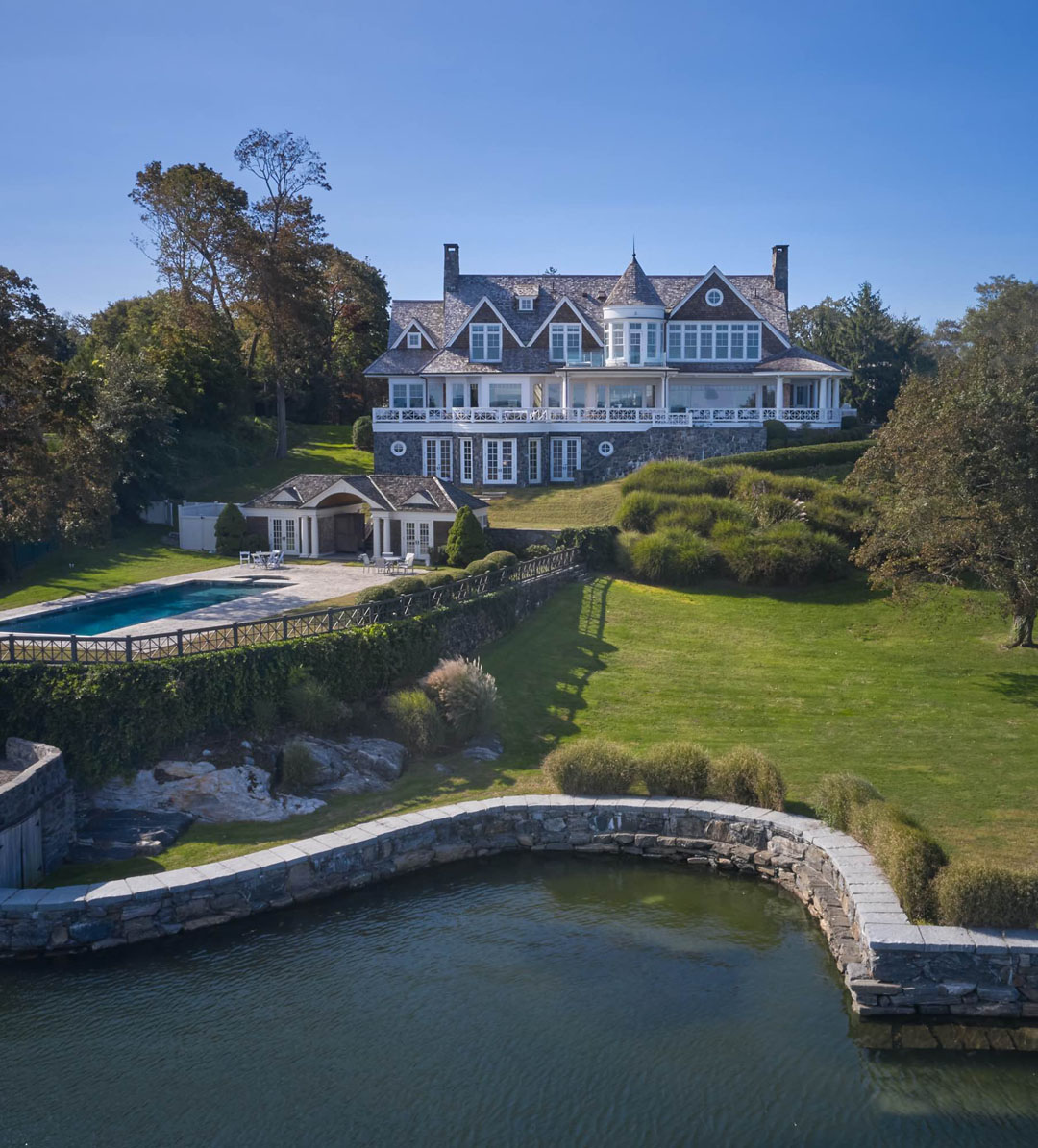 Luxury Shingle Style Coastal Home with Waterfront Pool