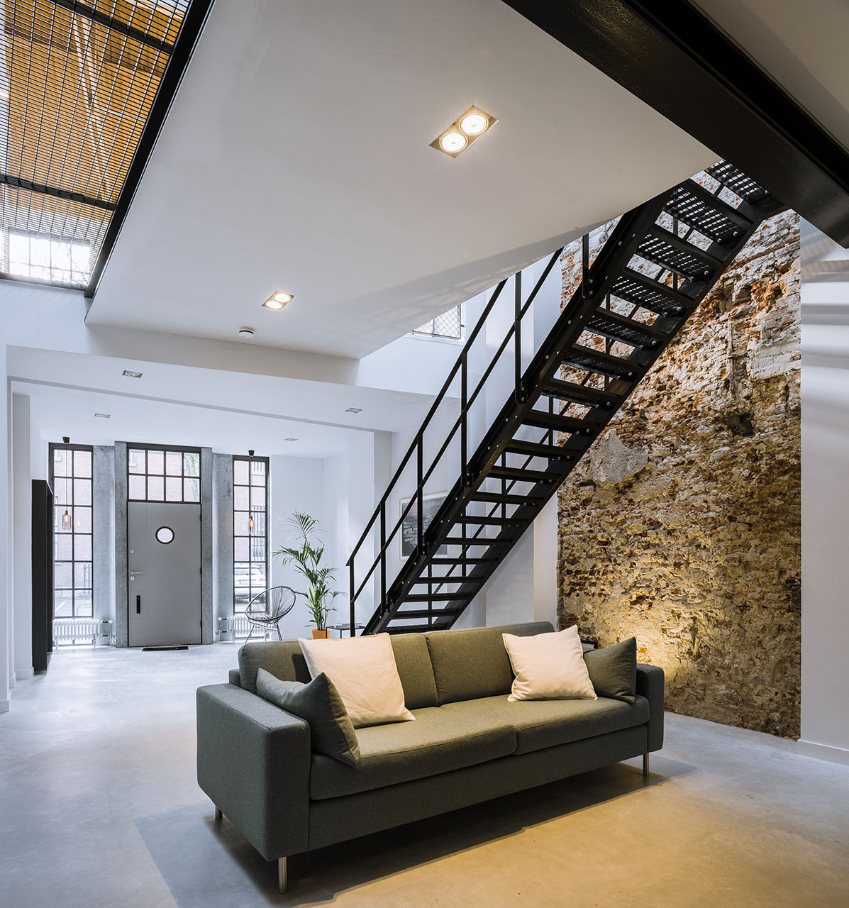 Elegant European Contemporary Loft with Stone Wall